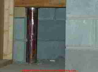 Photograph of light rust on a steel lally column.