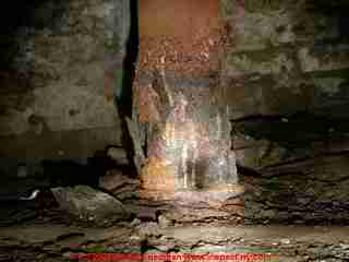 Photograph of exfoliating rust on a steel lally column.