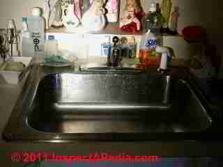 Mold growth on stainless steel kitchen sink © D Friedman at InspectApedia.com 
