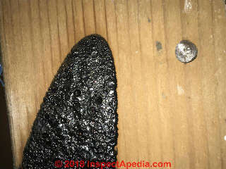 Black tarry deposit, not mold (C) InspectApedia.com Amber Zimmerman
