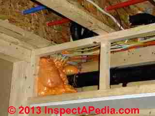 Plumbing chase after foam insulation (C) Daniel Friedman Eric Galow Galow Homes