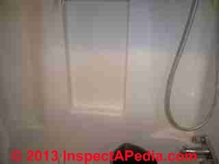 Suspected solvent odor source - tub surround (C) InspectApedia POD