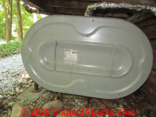Granby heating oil tank outside under a porch - on its "side" (C) InspectApedia.com Kahn