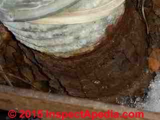 Closeup of exfoliating splitting rusting oil tank fill pipe in Rhinebeck NY (C) Daniel Friedman