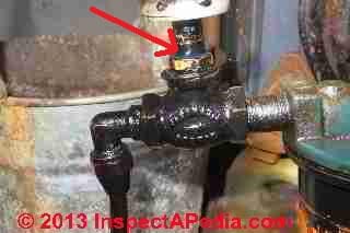 Oil piping leak at the fire safety valve on an oil fired steam boiler (C) Daniel Friedman