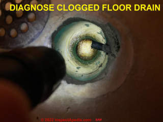 Diagnose clogged floor drain (C) InspectApedia.com Sam