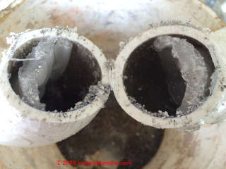 Paraffin clog in plumbing drain (C) InspectApedia.com reader