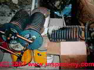 Pile of leaky tankless coils found at a home tell a story (C) Daniel Friedman