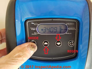 Water softener control buttons showing manual regen button (C) Daniel Friedman at InspectApedia.com