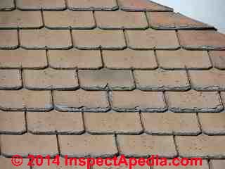 Worn damaged fibre cement roof cladding at Oamaru New Zealand (C) Daniel Friedman