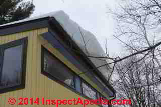 Snow slide off of high metal roof (C) Daniel Friedman