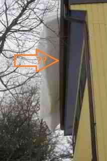 Gutter being bent by snow and ice creeping off of roof eaves (C) Daniel Friedman
