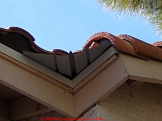 Metal vallet protrudes past inside soffit corner on an Arizona clay tile roof (C) InspectApedia.com Martin