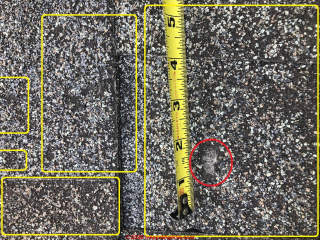 Scoured asphalt shingles with granule loss - possible hail or other damage (C) InspectApedia.com Scott