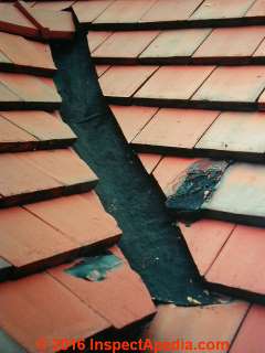 Tar or asphalt patched roof valley on a clay tile roof (C) Daniel Friedman