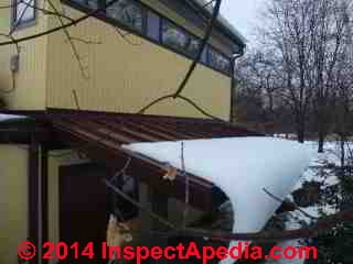 Metal roof with no snow guards, Poughkeepsie, NY (C) Daniel Friedman