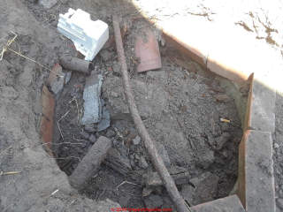 Collapsed seepage pit, drywell, or cesspool - unknown may be unsafe (C) InspectApedia.com Raul Ruiz