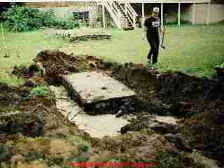 LARGER IMAGE: of a home made or site-built septic tank being excavated after failure.