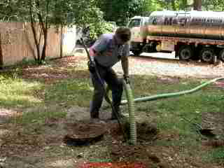 PHOTO of septic tank sludge being broken up for tank cleaning