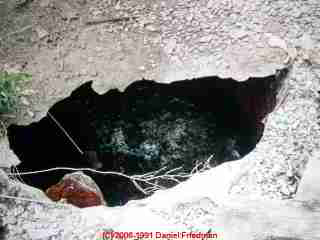Steel septic tank collapse © D Friedman at InspectApedia.com 