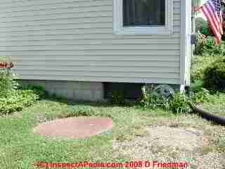 LARGER IMAGE: unsafe septic tank cover discovered by simple exploration - we roped this area off and placed heavy plywood over the opening - it was by a children's play area.