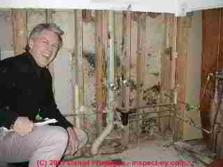 Photograph of Craig Balchunas inspedcting for mold .