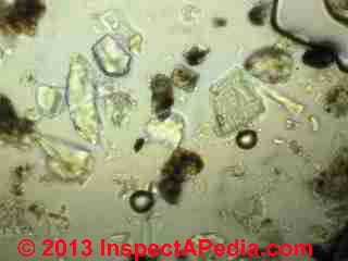 House dust particles - mineral fragments, street or road or masonry debris (C) InspectApedia