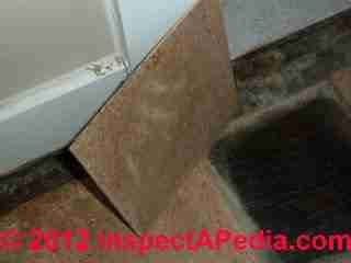 Vinyl asbestos floor tiles in cork tile pattern (C) InspectAPedia & GM
