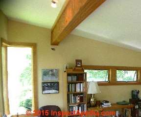 Wood laminate girder supporting roof left exposed © Daniel Friedman at InspectApedia.com