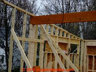 Structural beam below a cantilevered low slope roof © Daniel Friedman at InspectApedia.com