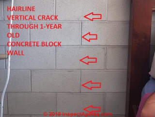 Vertical crack through 1-year-old concrete block wall (C) InspectApedia.com Amanda