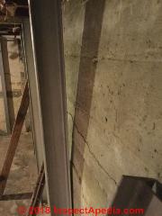 Horizontal crack in concrete foundation wall - house condemned? (C) InspectApedia.com Greg