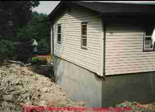 Photograph of a masonry block foundation collapse and repair