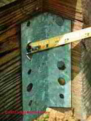 Roofing nails in joist hanger © D Friedman at InspectApedia.com 