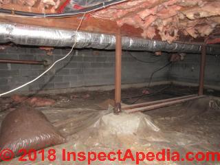 Rusty lally column in a basement is a tip off to flooding, mold risk, other issues (C) InspectApedia.com D.K. 