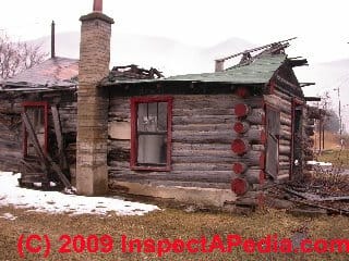 Photograph of  a modern kit log home with lots of leaks