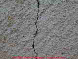 Photograph of a cracked concrete block foundation wall, probably from frost cracking. Drop a plumb line to measure total inwards bulging of this block foundation wall.
