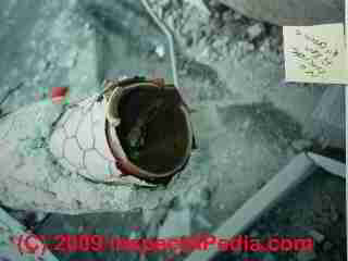 Northridge Meadows earthquake collapse photo showing hollow Lally Column © Daniel Friedman at InspectApedia.com