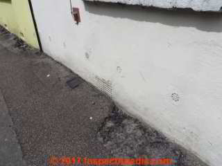 Masonry wall drain openings in Oxford, U.K. © Daniel Friedman at InspectApedia.com