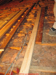 Old collar ties along with other lumber help workers avoid stepping through the ceilling below (C) Daniel Friedman at InspectApedia.com