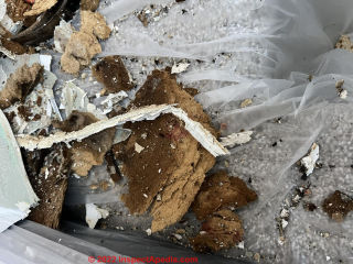 Fiberboard demolition vs. asbestos exposure (C) InspectApedia.com Ben