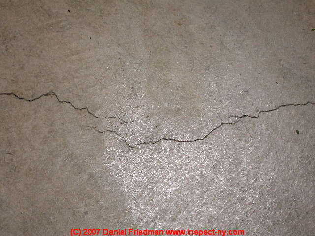 Photograph of a classic shrinkage crack in poured concrete.