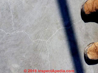 Shrinkage cracks in slab poured using Pene-Krete in South Texas hot weather (C) InspectApedia.com Dale Hart