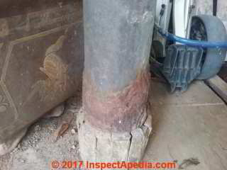 Damaged hollow steel column support below a car porch, possibly in Singapore (C) InspectApedia JK