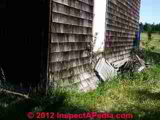 Wood at ground and insect + rot damage Two Harbors MN © Daniel Friedman at InspectApedia.com