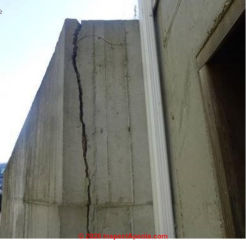 Serious vertical crack in a new concrete foundation wall (C) InspectApedia.com Josh