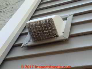 Lint clogged clothes dryer exhaust vent cleanout to avoid fire hazard (C) Daniel Friedman Brian Gilligan