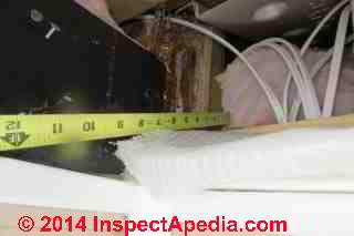 Roof ice dam leak diagnostic detail - exploring in the soffits (C) Daniel Friedman