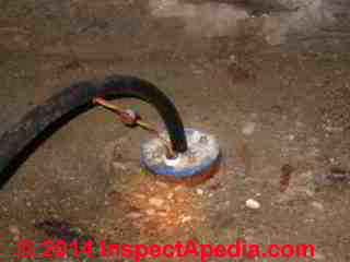 Submersible well pump wiring entering at the well casing top - an indoor well (C) Daniel Friedman