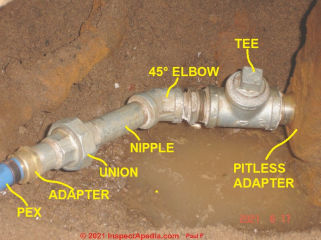 Galvanized well pipe at pitless adapter (C) InspectApedia.com Paul F